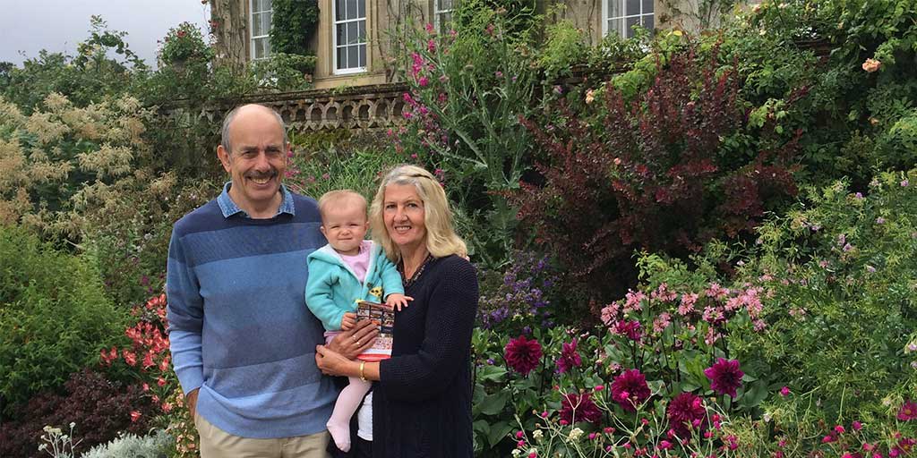 pregnant woman walking a dog